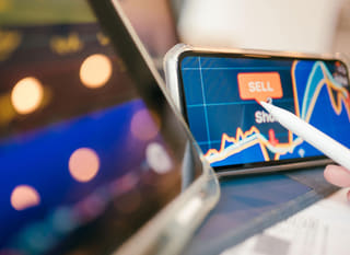 Trader examining Bitcoin, Ethereum, and currency pair trading opportunities across multiple markets