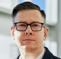 Executive portrait of Alexander Hughes, chief executive officer at a cryptocurrency trading firm
